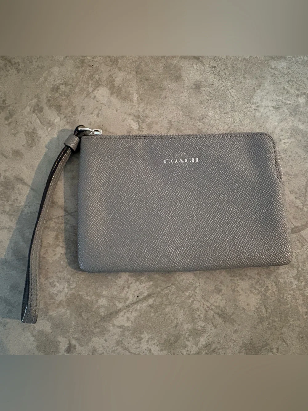 Coach Corner Zip wristlet in a metallic crossgrain leather